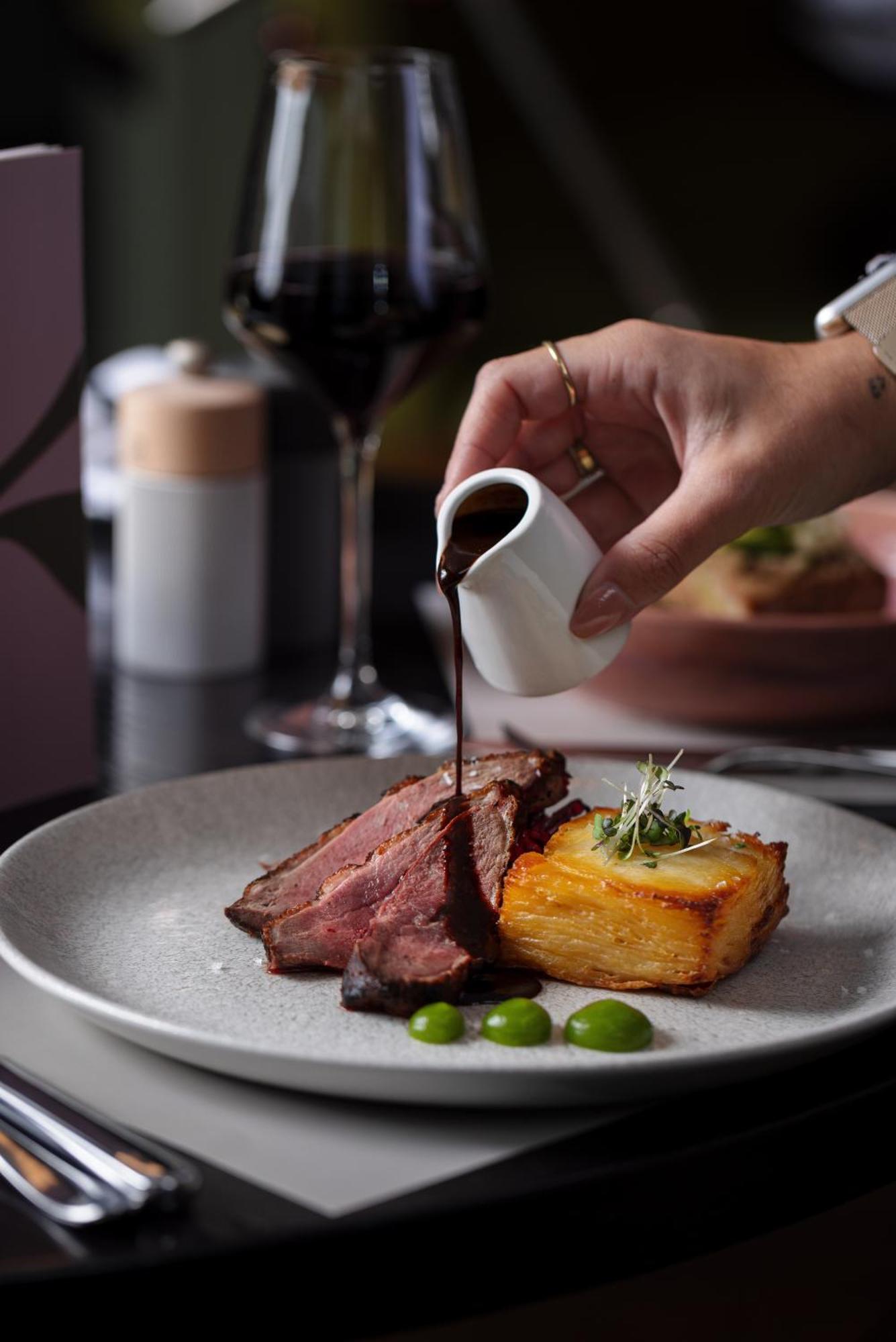 The Morrison Dublin, Curio Collection By Hilton Hotel Екстериор снимка A steak being drizzled with a sauce